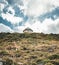 Crete, Greece, small unfinished church, amazing chapel abandoned in the mountains stones and rocks with blue sky, sunny