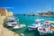 CRETE ISLAND, GREECE, SEP 12, 2012: View on beautiful classic old piscatory small sea boats ships, white yachts, Greek Heraklion s