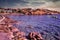 Crete island  Greece: Wide angle shot of rocky beach with blue sea water with luxury swim water floats for kids and adults. Beach