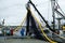 Crew of fishing boat loading nets