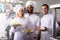 Crew of professional cooks working at restaurant