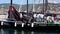 The crew of the sailboat haul down the sails during the 53 Barcolana regatta in the Trieste sea