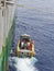 The Crew of a Seismic Vessel in the South Atlantic in the water and still on the Painter line warming up their engines.