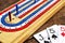 Cribbage board and playing cards