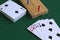 Cribbage wooden games.playing card and cribbage board on the green.