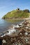 Criccieth beach Wales UK historic coastal town in summer with blue sky on a beautiful day