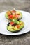 Cricket Ceviche served in an Avocado