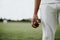 Cricket player holding a leather ball