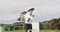 Cricket umpire making signs standing on a cricket pitch