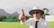 Cricket umpire making signs standing on a cricket pitch