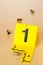 Crime scene investigation CSI evidence marker with empty, fired 9mm bullet casings on wood floor background at crime scene -