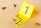 Crime scene investigation CSI evidence marker with empty, fired 9mm bullet casings on wood floor background at crime scene -