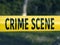 Crime scene yellow police tape closeup