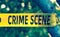 Crime scene yellow police tape closeup