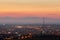 Crimea. Simferopol from a bird`s-eye view in the rays of the setting sun. The city is in the backlight.