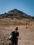 Crimea, Sudak - June 16, 2019: hiker at entrance to Soldaia Castle - medieval Genoese fortress, famous landmark