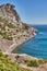 Crimean peninsula. People walk along the tourist route Golitsyn Trail. Botanical reserve New World