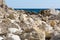 Crimean seascape with rocky beach, strewn with large pebbles