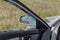 Criminal incident. Hacking a car. Broken driver`s side window of car. Thieves smashed window of car with fragments inside, glass