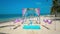 Crimson, blue Wedding arch on the Caribbean beach