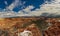 Crimson-colored hoodoos under the cloudy sky in the Bryce Canyon National Park, Utah, USA