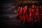 Crimson Dried Pepper on a Rich Dark Wood Background. AI