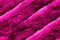 Crimson pink artificial fur with realistic glossy texture seamless pattern. Winter fashion color surface wool stripe