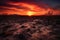 crimson sunset over barren desert landscape