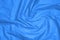 Crinkled blue material texture or background