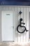 Cripple sign on toilet wall