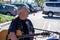 Cris Hagen and Mike play guitars as the entertainment band for the Simi Valley Farmer`s Market. Cris Hagen speaks to tourists.