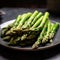 crisp asparagus spears arranged beautifully on a plate