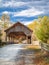 Crisp autumn day surrounds High Dupont Forest covered bridge