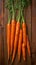 Crisp carrots arranged on a wooden table, farm fresh goodness