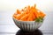 Crisp and fresh Frozen orange carrot in white bowl, healthy