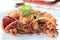Crisp fried Calamari or deep fried squid with garlic in the white plate
