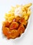 Crisp fried potato chips with spicy Currywurst