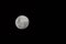 A crisp full moon with a black background