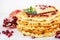 Crisp golden fresh baked waffle topped with pomegranate