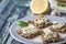 Crisp grain bread with tzatziki on the blue ceramic plate horizontal