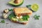 Crisp toast with sliced avocado, cream cheese