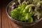 Crisphead lettuce in a bowl on wooden table.