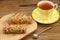 Crispy appetizing bread with strawberries on a plate on  wooden background