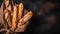 Crispy baguettes in packaging on a dark background, top view