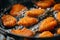 Crispy Breaded Chicken Tenders Frying in Oil for Fast Food Concepts and Menu Visuals