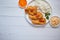 Crispy chicken fried in breadcrumbs served with rice. View from the top on white wooden background