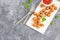 Crispy Chicken Popcorn with Tomato Ketchup, Garnished with Mint Leaves, Top Down, Flat Lay Photo on Dark Background