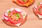 Crispy Cracker Sandwiches with Tomato, Sausage, Cheese, Green Onions and Radish