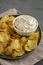 Crispy Crinkle Potato Chips and French Onion Dip on a Plate, side view