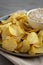 Crispy Crinkle Potato Chips and French Onion Dip on a Plate, side view. Close-up